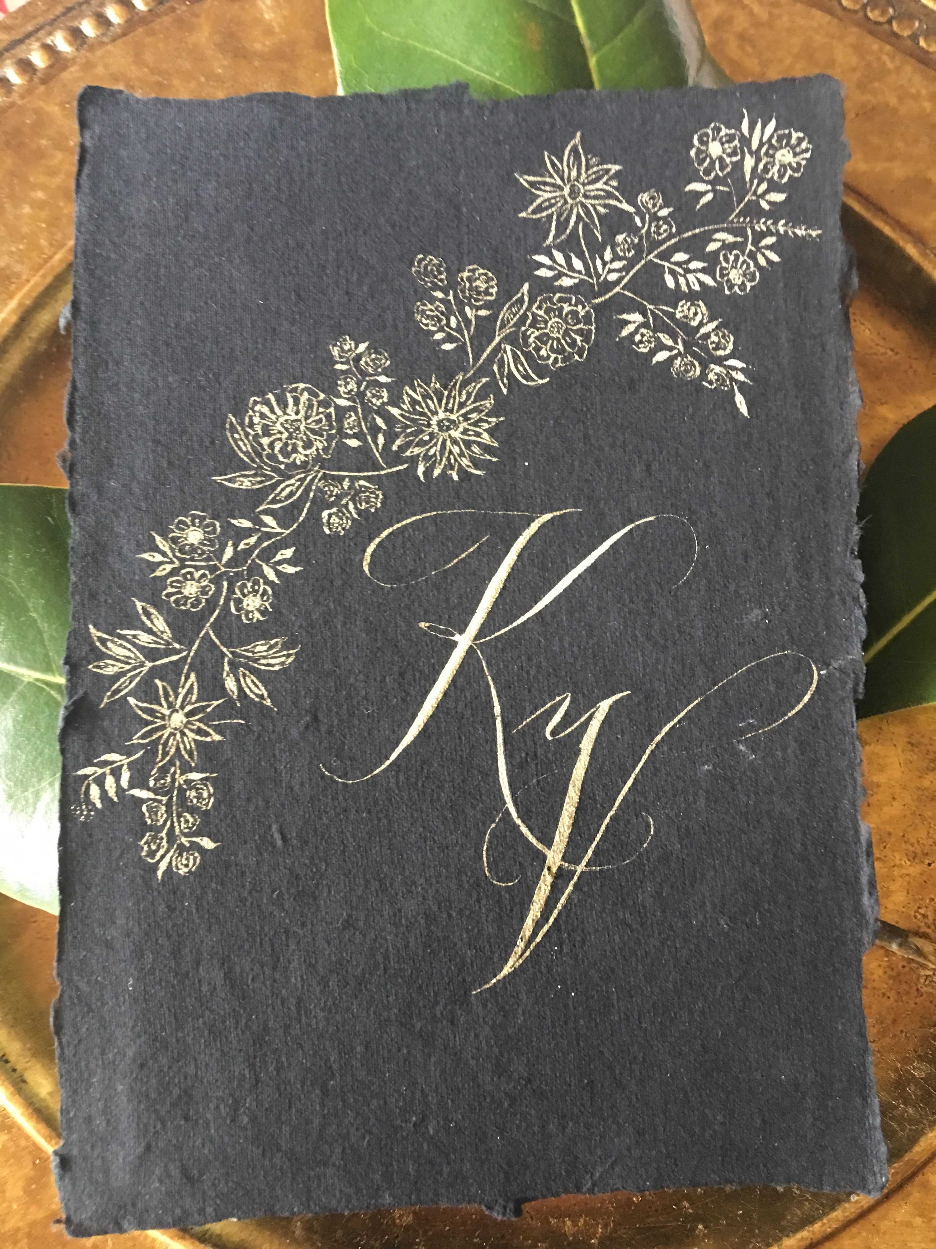 handmade paper with floral vine and custom monogram